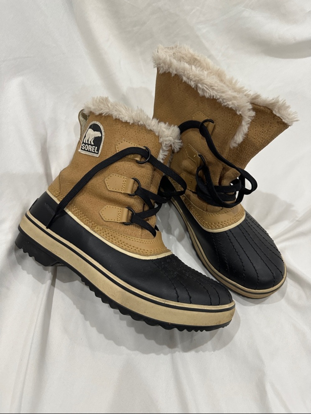 Sorel women’s Tan and Black Faux-Fur Lined Winter Boots
